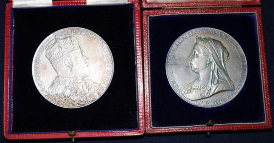 Two cased commemorative coins.